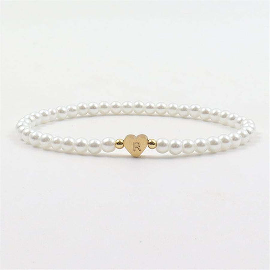 Stijlvolle parel armband, ontworpen om een persoonlijke en tijdloze uitstraling te geven.
