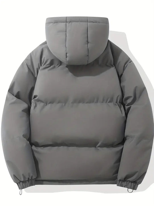 Tijdloze pufferjas die makkelijk te combineren is met verschillende outfits.