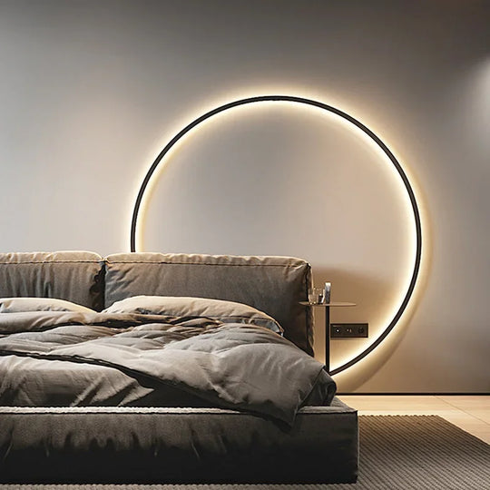 Ring wandlamp met warm LED-licht, ideaal om een rustige en moderne uitstraling aan de slaapkamer toe te voegen.