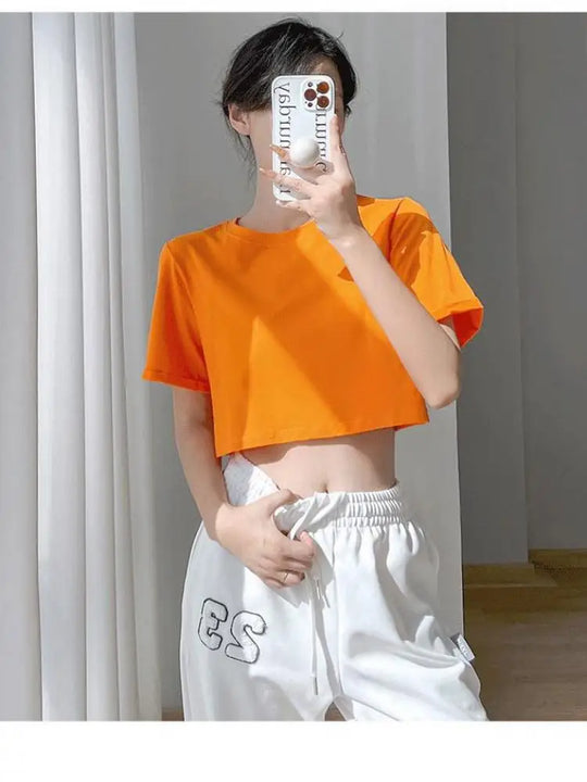 Lina | Slim-fit summer top with round neck and short sleeves for women | Orange