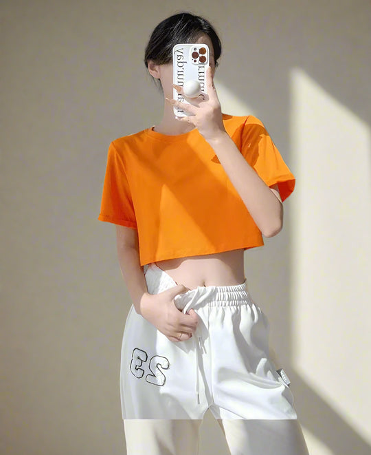 Lina | Slim-fit summer top with round neck and short sleeves for women | Orange