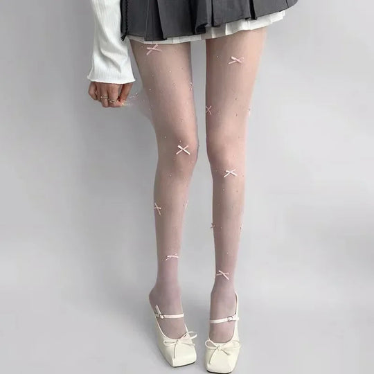 Simone | Speelse panty met strikpatroon