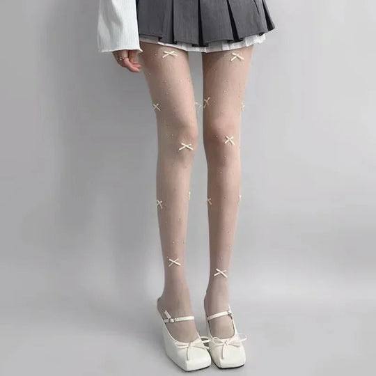Simone | Speelse panty met strikpatroon