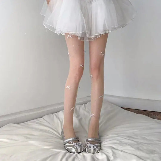 Simone | Speelse panty met strikpatroon