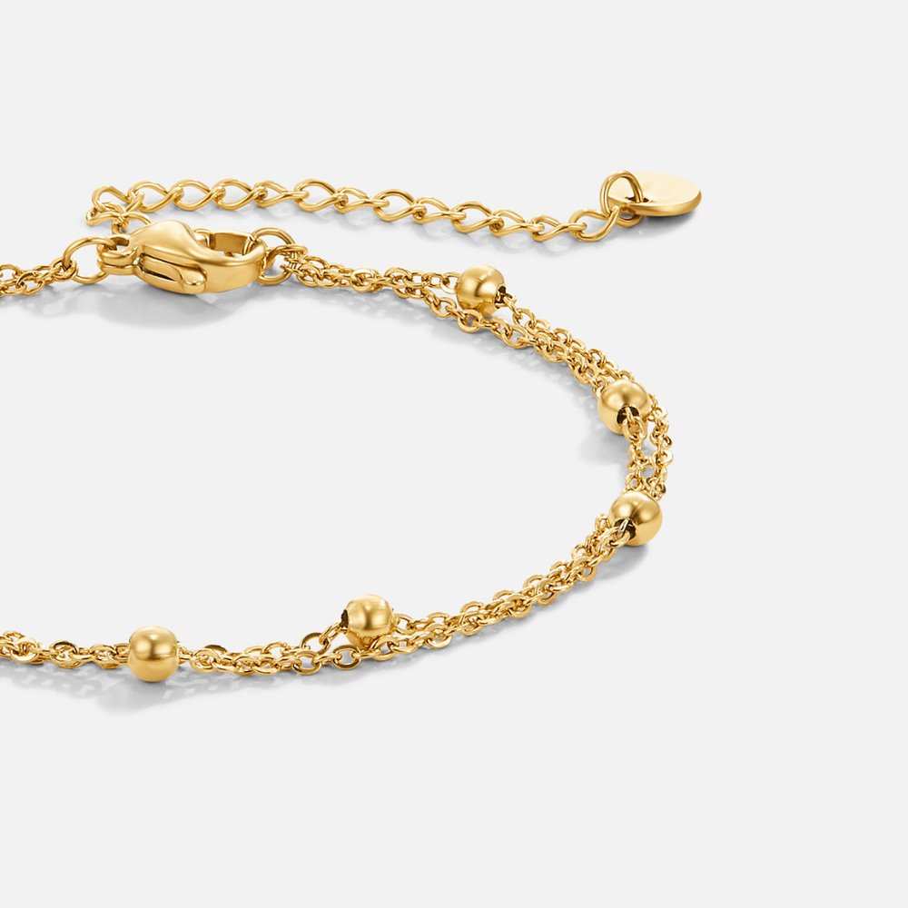 Fijn ontworpen armbanden met dubbele lagen voor een moderne en verfijnde uitstraling.
