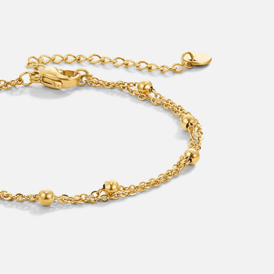 Fijn ontworpen armbanden met dubbele lagen voor een moderne en verfijnde uitstraling.

