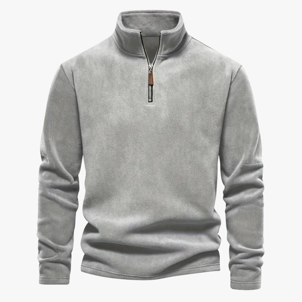 Half-zip kraag van de sweater in close-up voor extra stijl.
