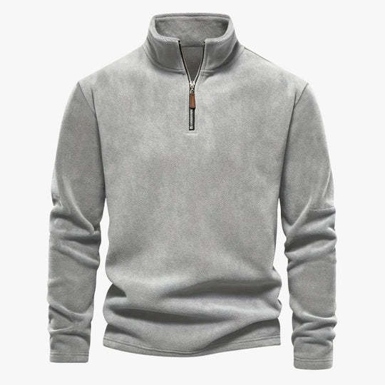 Half-zip kraag van de sweater in close-up voor extra stijl.
