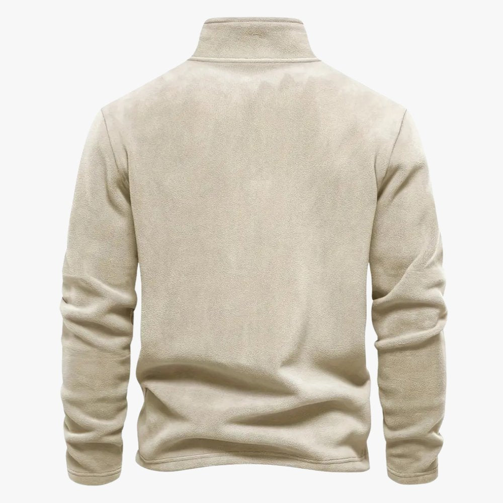 Close-up van de half-zip kraag met een leren trekkoord detail.
