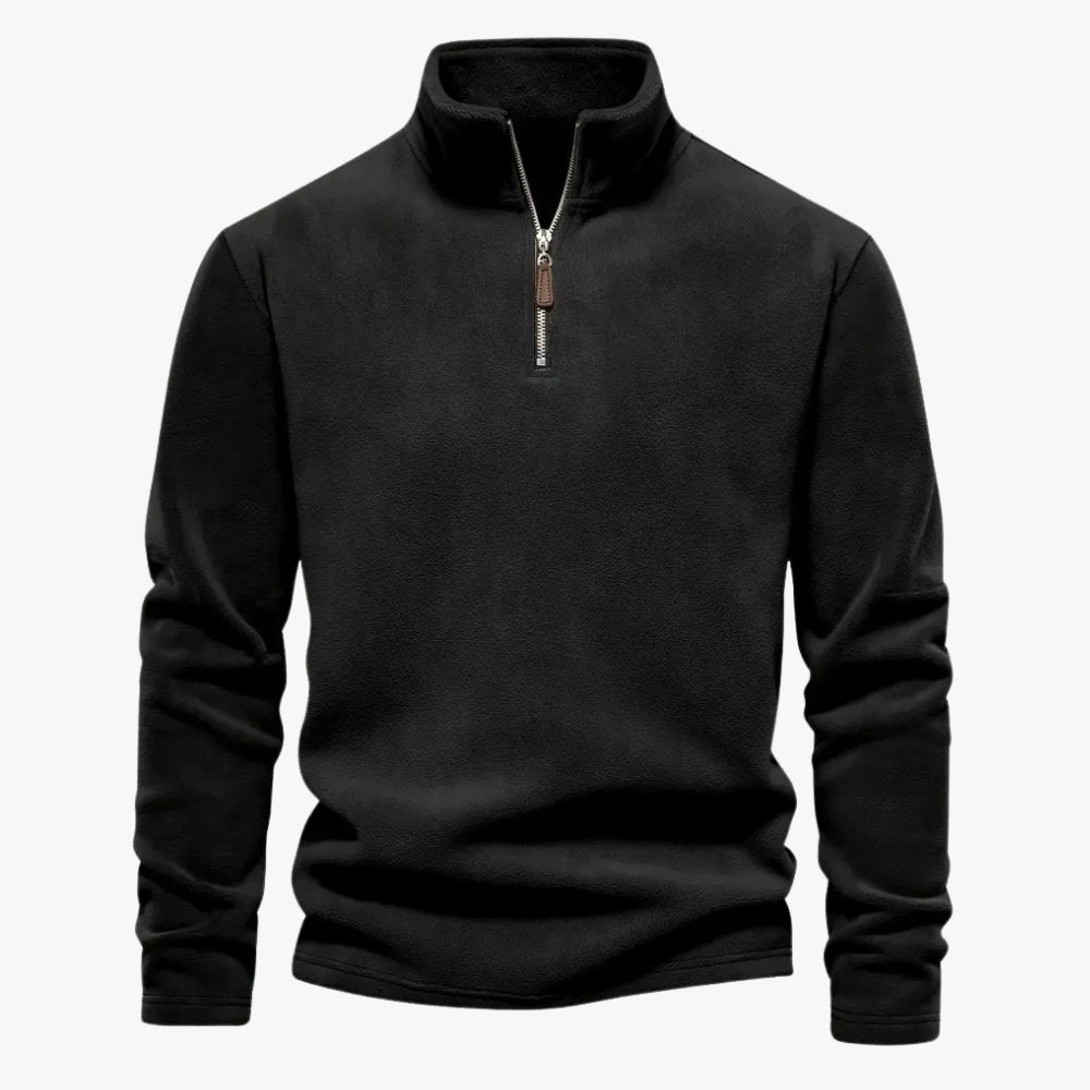 Elastische afwerking aan de zoom van de beige sweater.
