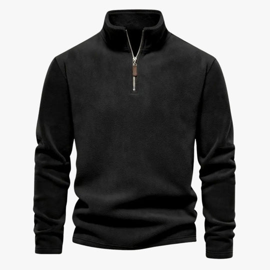 Elastische afwerking aan de zoom van de beige sweater.
