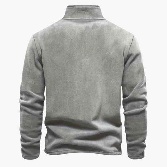 Beige casual sweater met een zachte fleece stof en strakke pasvorm.
